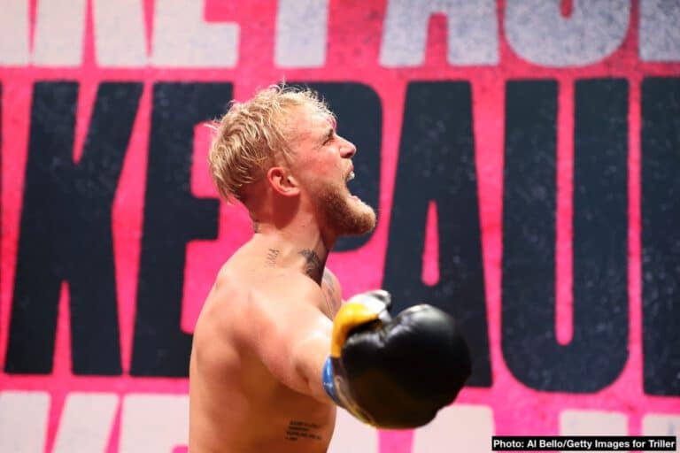 Daniel Cormier runs up on Jake Paul at UFC 261 in confrontation