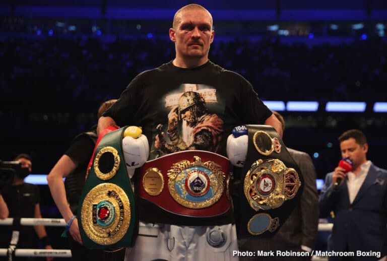 Oleksandr Usyk shows off his belts he won from Anthony Joshua