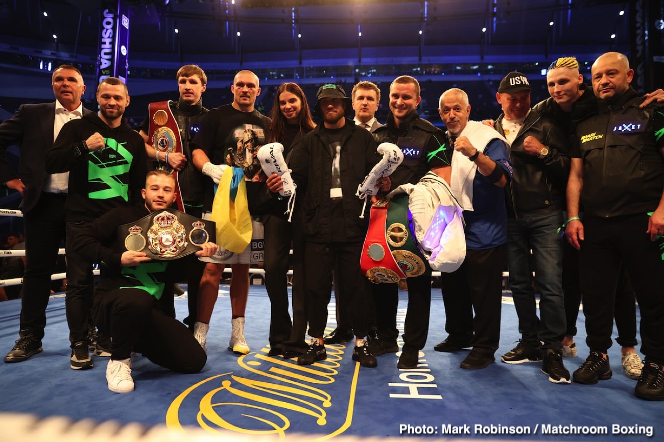 Oleksandr Usyk shows off his belts he won from Anthony Joshua